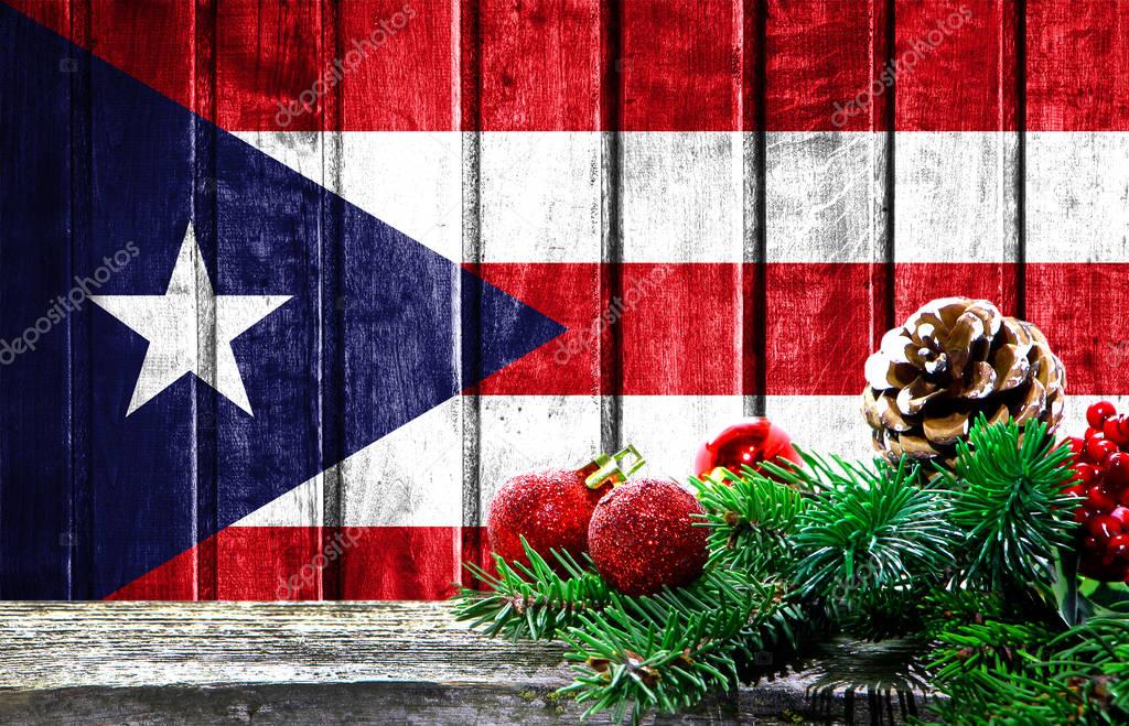 Wooden Christmas background with a flag of Puerto Rico. There is a place for your text in the ...