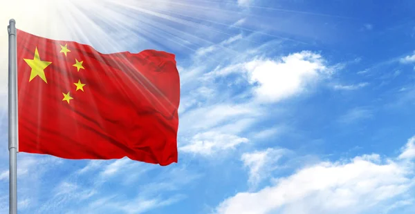 Flag of China on flagpole against the blue sky