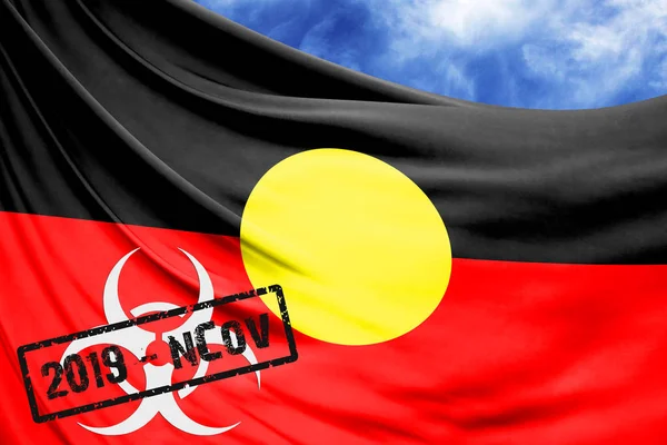 Novel coronavirus disease named 2019-nCoV with Australian Aboriginal flag closeup on blue sky background