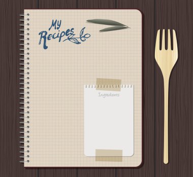 Tarifi dizüstü grafik el ile metin çizilmiş. Zeytin yaprağı ve levha yapıştırıcı bant ile bağlı küçük dizüstü bilgisayar. Ahşap çatal. Ahşap arka plan.