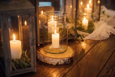on festive table in wedding banquet. the table is decorated with compositions of greenery