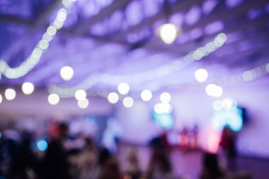 Light bulb decor in indoor party. blurred photo