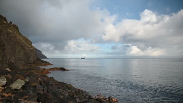Hills facing the ocean on a sunny day in Tenerife, cargo ship waiting outside the port — 图库视频影像