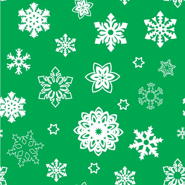 Рождественский узор из маленьких и больших снежинок, белый на зеленом. белый силуэт — стоковый вектор