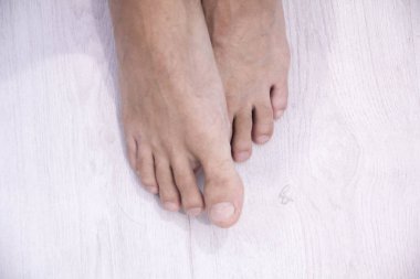 top view of Male nail and feet on white background,This has a clipping path clipart