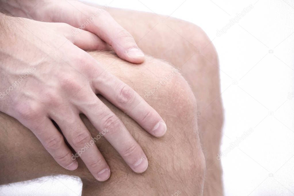 man with knee pain and feeling bad in medical office. osteoarthritis joint pain after sport. Breaks and sprains of the knee joint