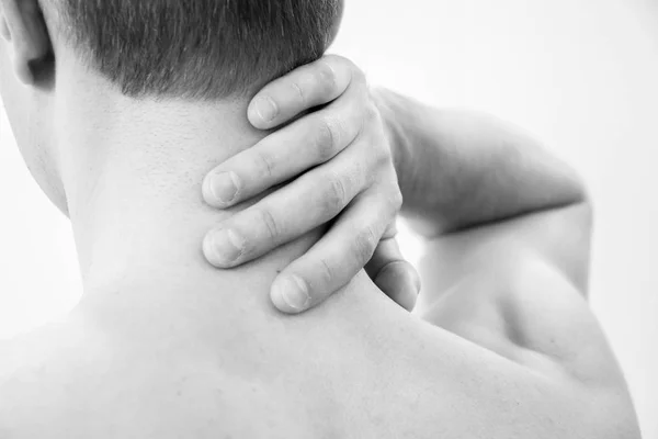 Pain in the neck. Man with backache. Muscular male body. Isolated on white background red dot. healthcare and problem concept unhappy suffering from or shoulder at home