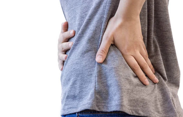 Çekici kadın kişi sırt ağrısı muzdarip. Tüm beyaz zemin üzerine. yaralanma kadın sırt ağrısı sırt ağrısı, omurilik uzanır. Neden uzun çalışma saatleri ve sağlık.