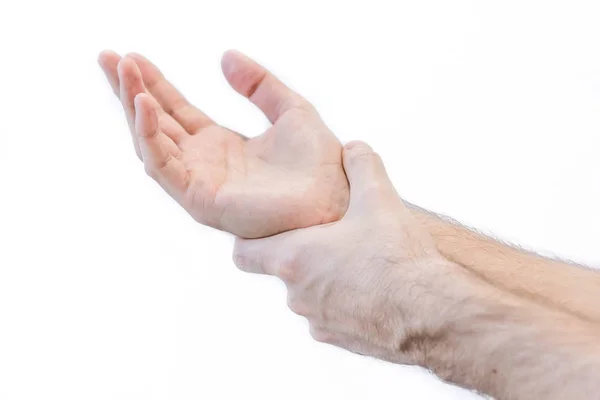 Homem segurando a mão - conceito de dor dor lombar, articulação danificada após o esporte.. isolar no fundo branco — Fotografia de Stock