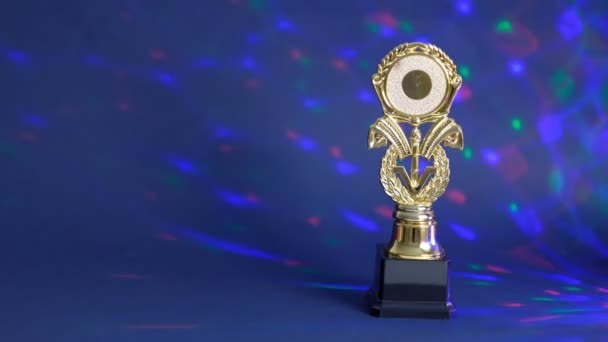 Champion golden trophy placed on black background. Shiny award in the spotlight. Concept of success, achievement, victory, a prize. — 비디오