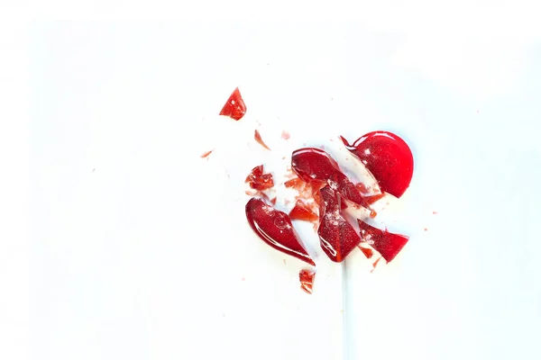 Broken heart red lollipop sweet isolated on white background — Stock Photo, Image