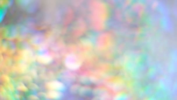 Color neon gradient. The rainbow sheen. Holographic background. Moving abstract blurred background. silver paper with a holographic effect. close up Shot Slow Motion video — Stock Video
