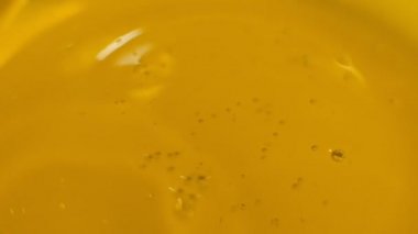 Oil drops and ripple. Drops of oil falling in pond and making ripple. Slow motion. Shot video.