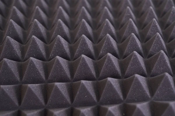Das Muster der schalldichten Platte aus Polyurethanschaum. schwarzer geometrischer Hintergrund — Stockfoto