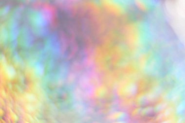 Renk neon gradyanı. Soyut bulanık arkaplan. Holografik efektli gümüş kağıt. Yakın çekim.