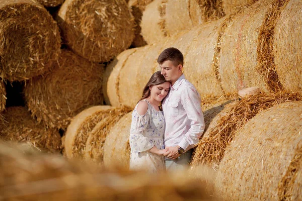 Happy young couple on straw, romantic people concept, beautiful landscape, summer season — Stock Photo, Image