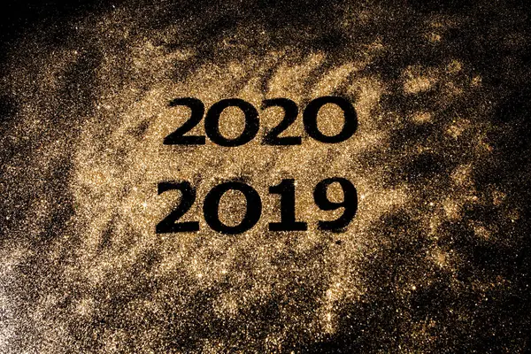 Beautiful sparkling Golden Numbers of 2019 to 2020 on black background for design, happy new year concept — Stock Photo, Image