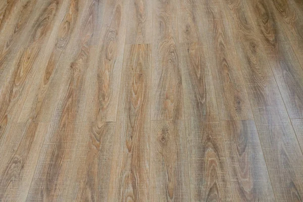 The floor of the light brown laminate diagonally — Stock Photo, Image