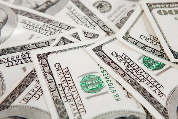 Achtergrond van verspreide dollarbankbiljetten als abstract naadloos. getemperd beeld — Stockfoto
