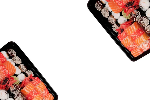 Grande Sushi Set Caixa Plástico Preto Fundo Branco Vista Superior — Fotografia de Stock