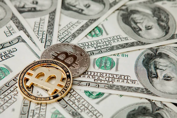 Bitcoin on US dollar bills. Electronic money exchange concept.