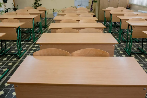 selective soft and blur focus.old wooden row lecture chairs in classroom in poor school.study room without student.concept for education.
