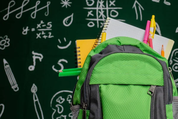 Education Concept Green Backpack Notebooks School Supplies Background Blackboard — Stock Photo, Image