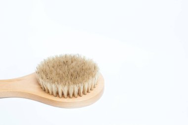 Closeup of cactus fiber body brush isolated on a white background. Natural, plastic free beauty tool. Bath and home self care concept. Flat lay, top view. Copy space for your text.