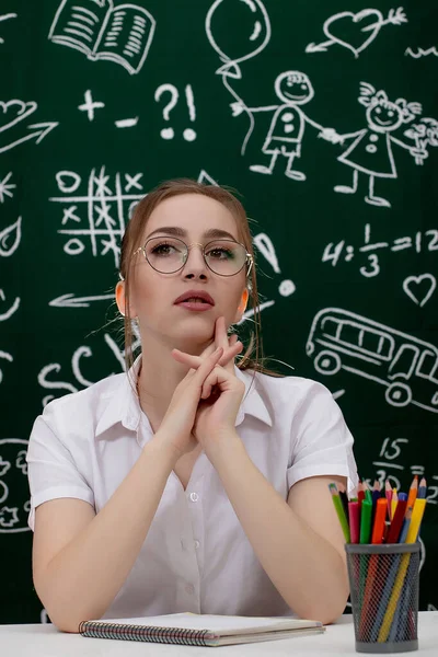 Young Teacher Sitting Blackboard Classroom — Stock Photo, Image