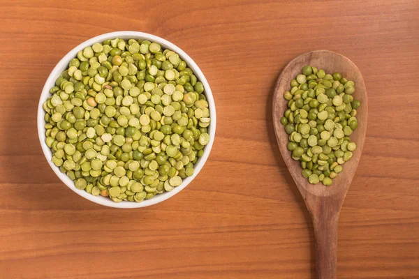 Dried Green Peas into a bowl — Stock Photo, Image