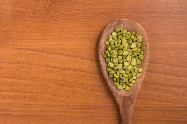 Dried Green Peas into a spoon — Stock Photo, Image