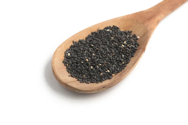 Black Sesame into a spoon — Stock Photo, Image