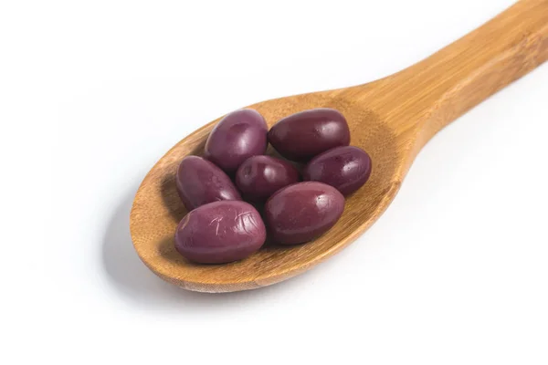 Svarte oliven i skje – stockfoto