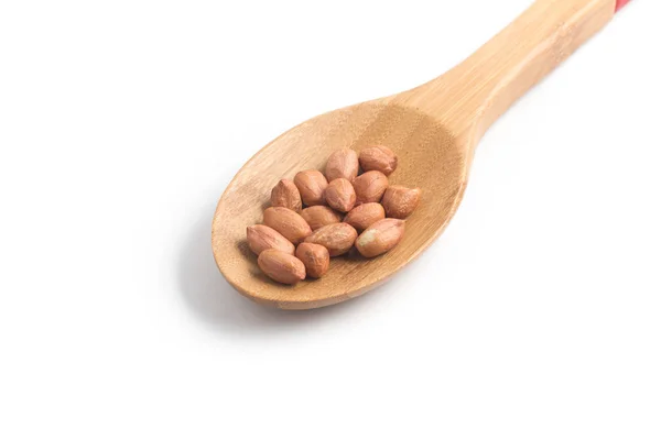 Peanuts pile. Shell Seeds into a spoon — Stock Photo, Image