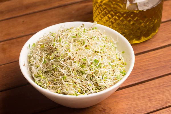 Alfalfa Sprouts into a bowl — Stock Photo, Image