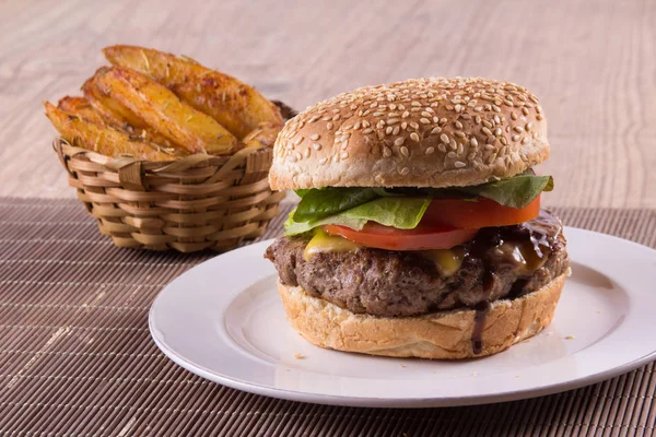 Burger with cheese, onions and salad — Stock Photo, Image