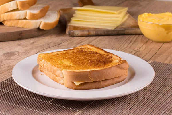 Hot cheese with toasted bread. — Stock Photo, Image