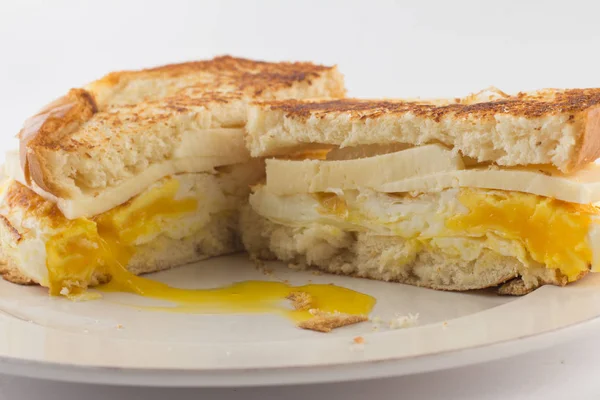 Toasted bread with eggs and cheese — Stock Photo, Image