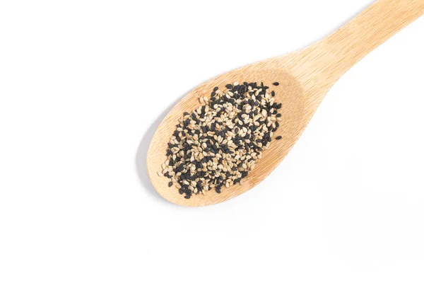 White and black sesame in a spoon — Stock Photo, Image