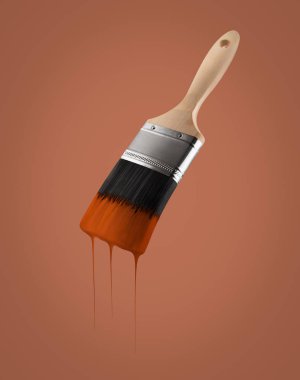 Kahverengi renk kahverengi zemin üzerinde kıllar kapalı damlama ile yüklenen boya fırçası.