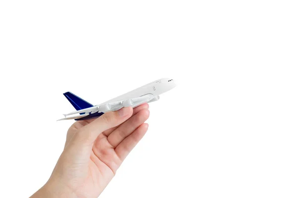 Woman hand holding model airplane, isolated on white background. — Stock Photo, Image