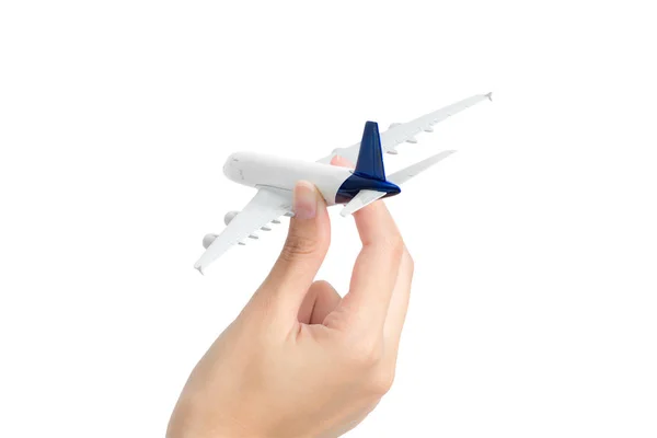 Mulher mão segurando avião modelo, isolado no fundo branco . — Fotografia de Stock