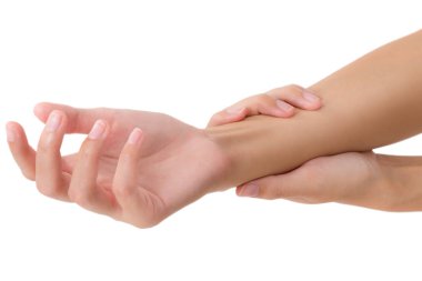 güzel sağlıklı bileğini tutarak ve ağrı alanında Masaj, beyaz arka plan üzerinde izole kadın.