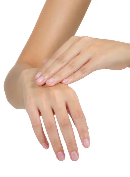 Frau hält ihre schöne gesunde Hand und massiert im Schmerzbereich, isoliert auf weißem Hintergrund. — Stockfoto