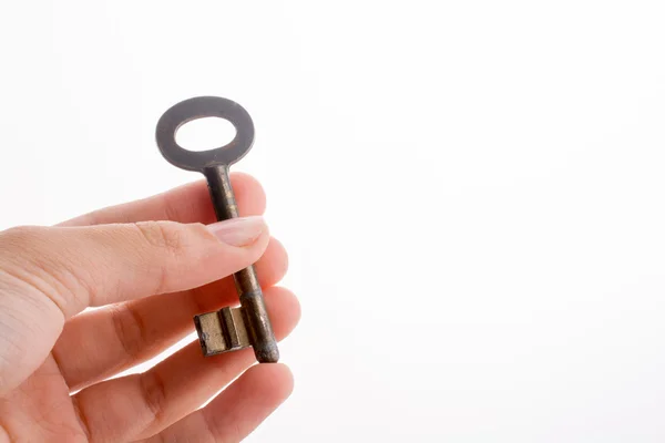 Mão segurando uma chave — Fotografia de Stock