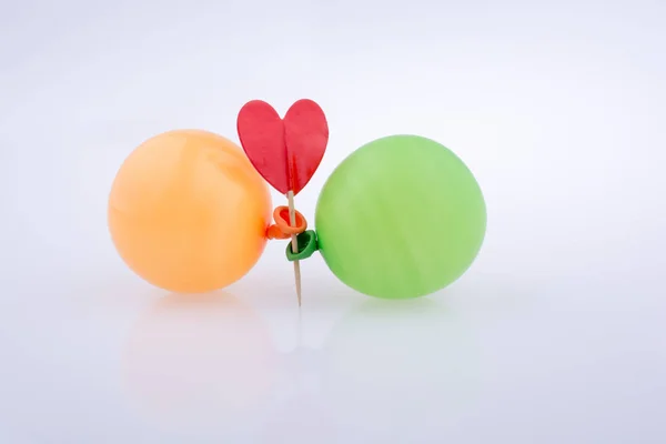 Red heart and colorful small Balloons — Stock Photo, Image