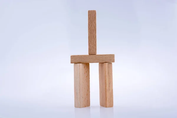 Domino de madera sobre fondo blanco — Foto de Stock