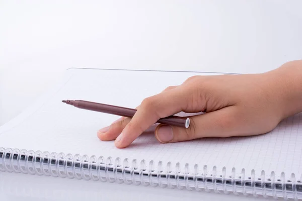 Escrita à mão em um caderno — Fotografia de Stock