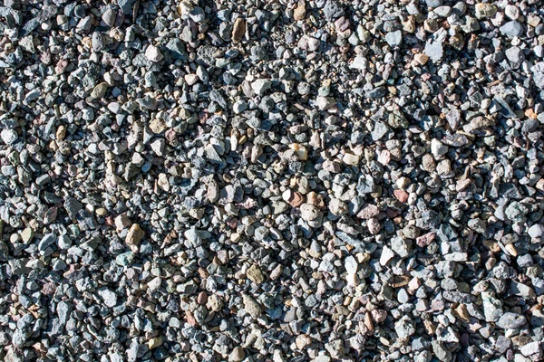 Фон, полный маленьких камней — стоковое фото