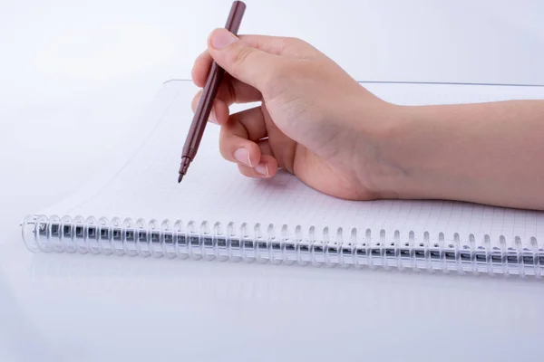 Escribir a mano en un cuaderno — Foto de Stock